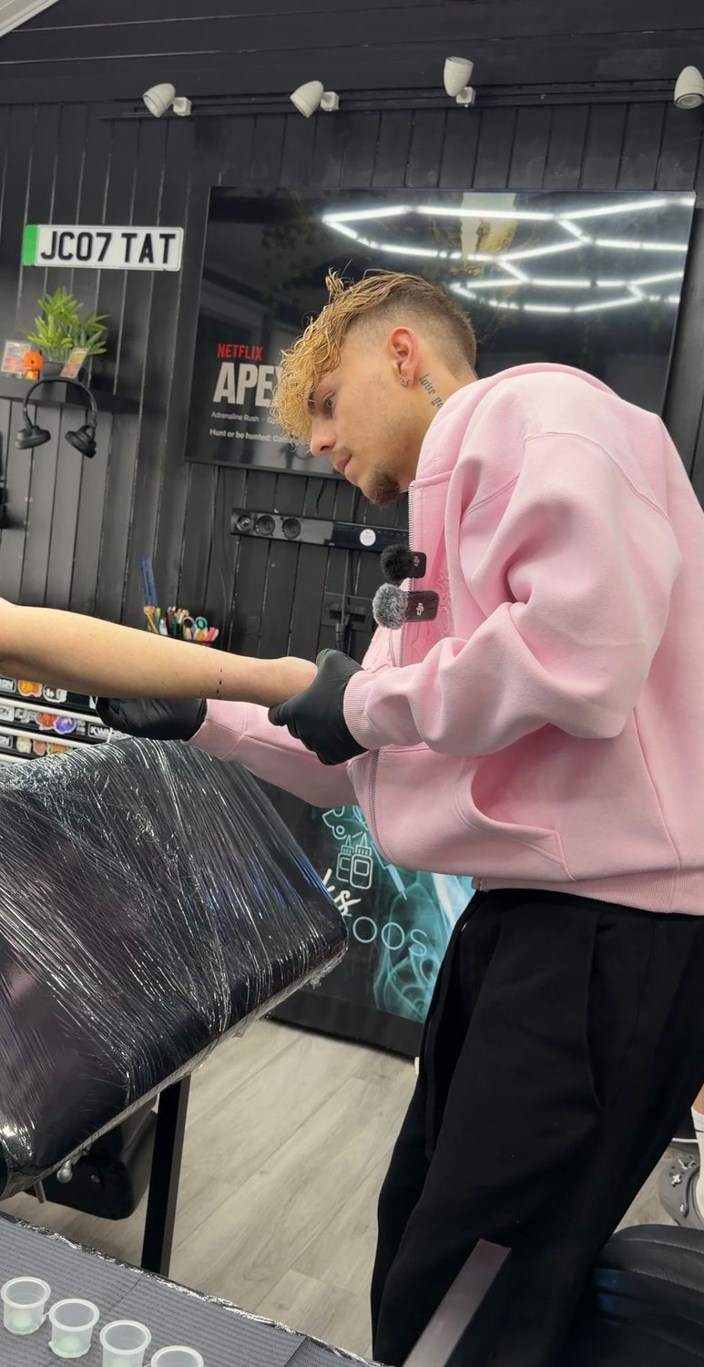 Jack working on a tattoo