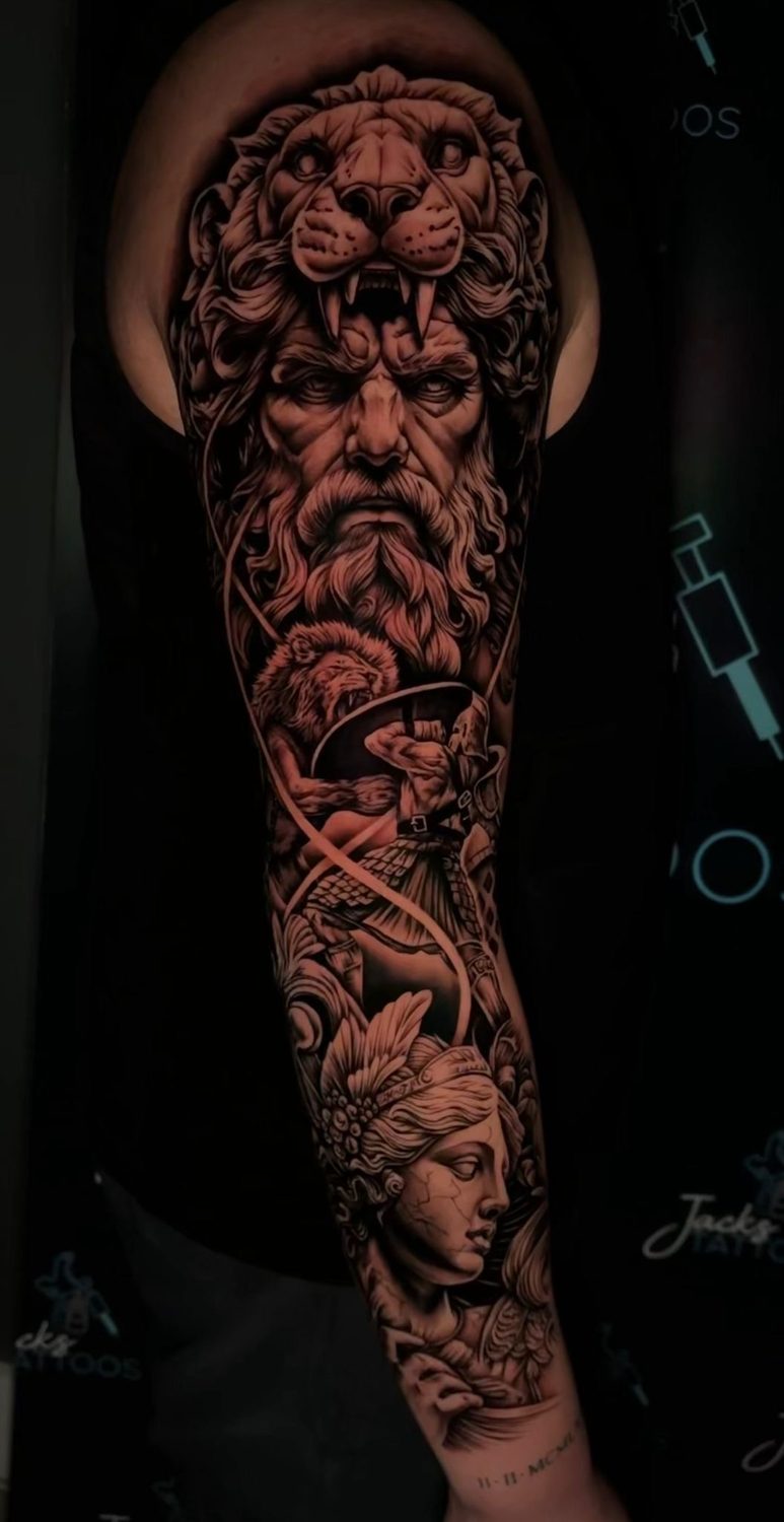 Black and grey Greek mythology lion headdress full sleeve tattoo