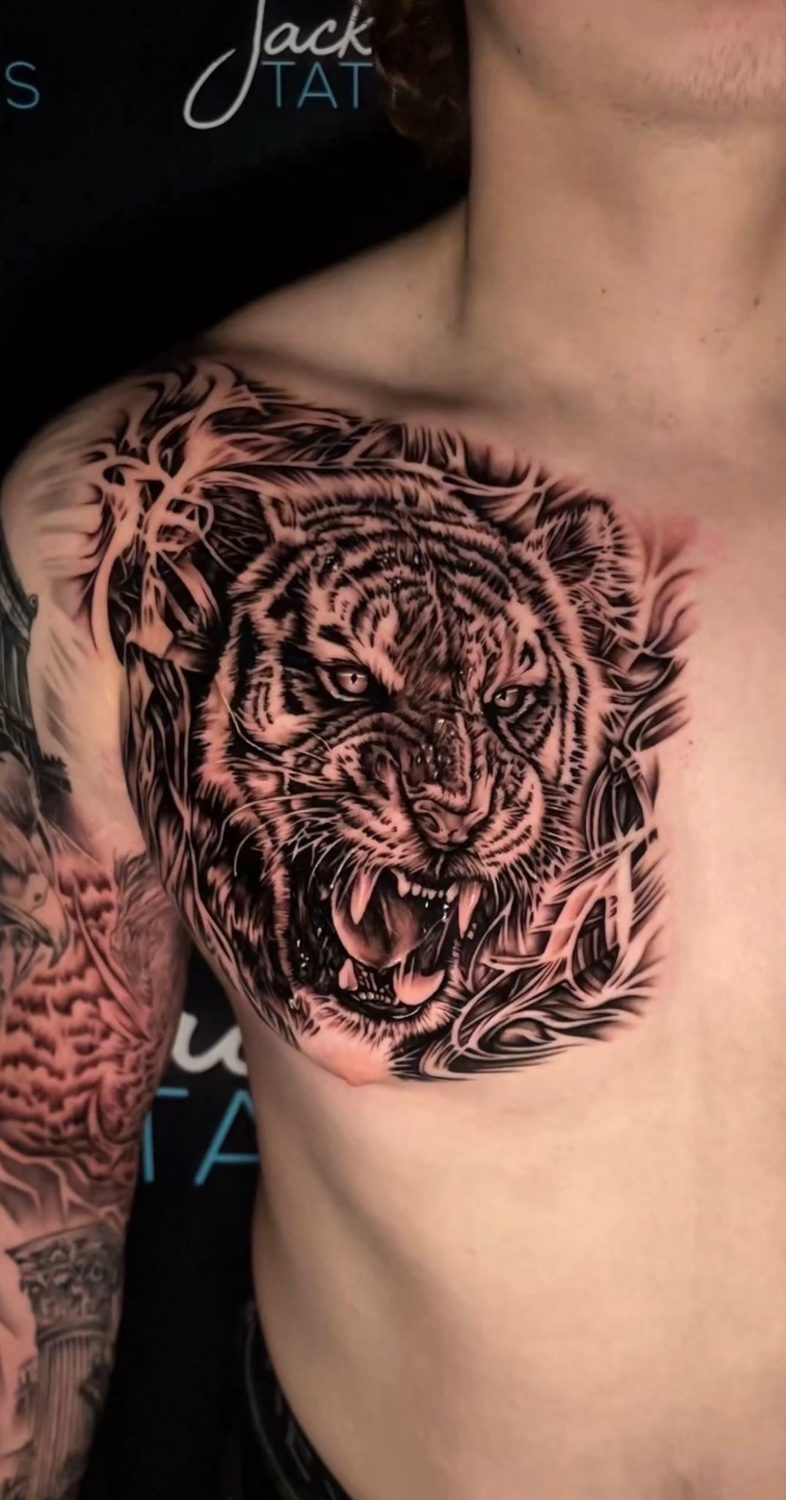 Black and grey roaring tiger chest tattoo