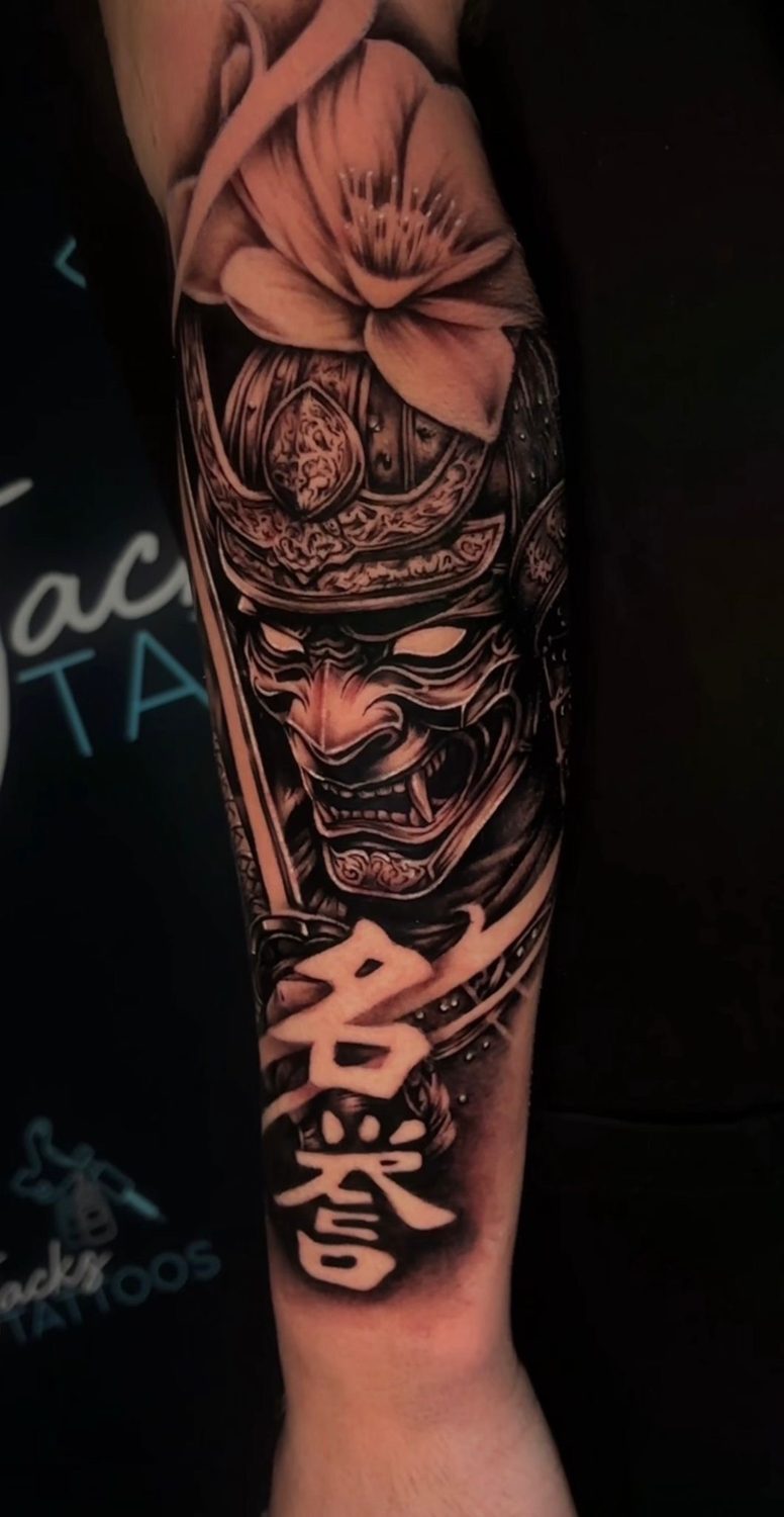 Black and grey Japanese samurai hannya mask and cherry blossom tattoo