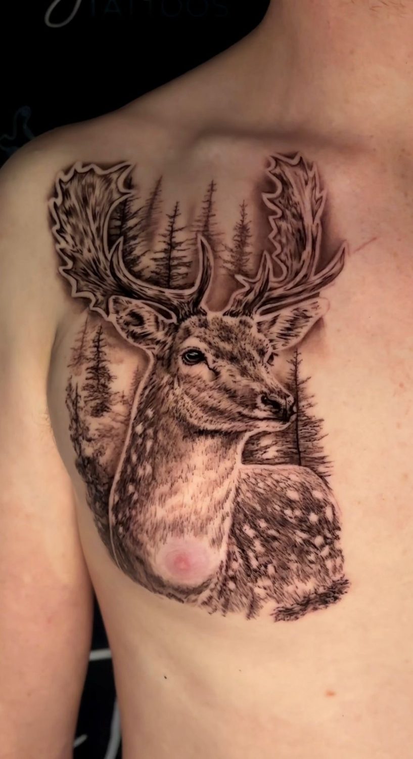 Black and grey realistic stag deer chest tattoo