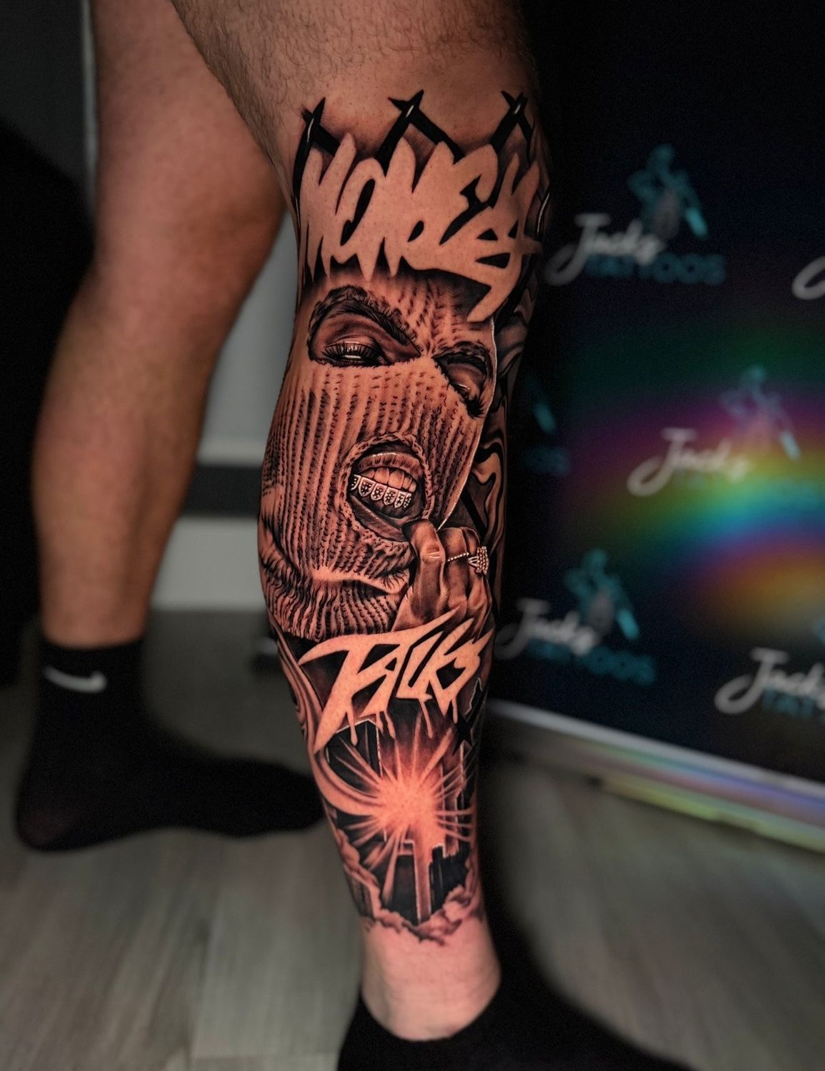 Black and grey money and balaclava graffiti realism leg tattoo